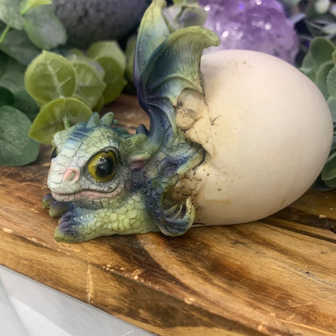 Poly resin hatchling baby dragon laying down